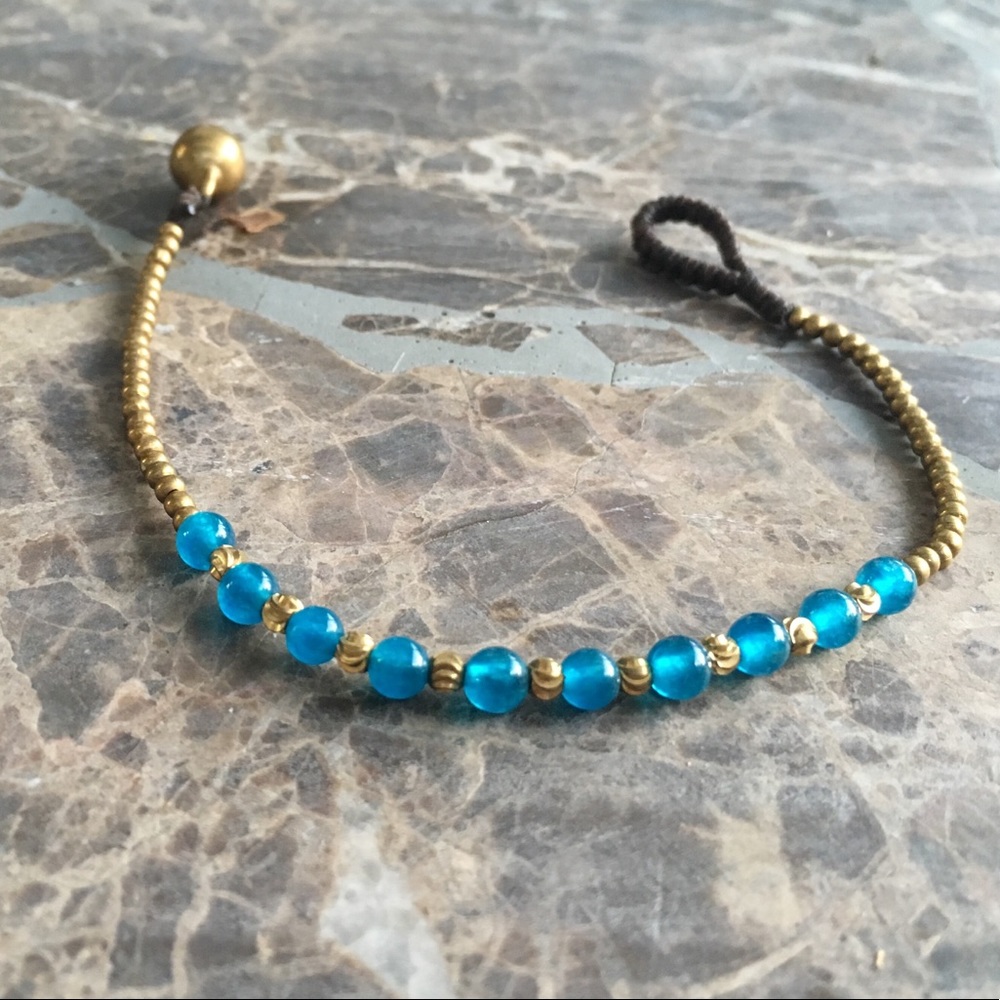 Hand woven beaded boho bracelet with brass bell